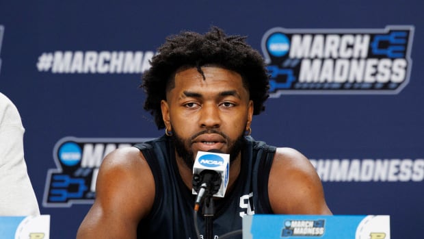 Purdue Boilermakers' Trevion Williams (50) answers questions during practice before the first round of the 2022 NCAA Tournament at Fiserv Forum.